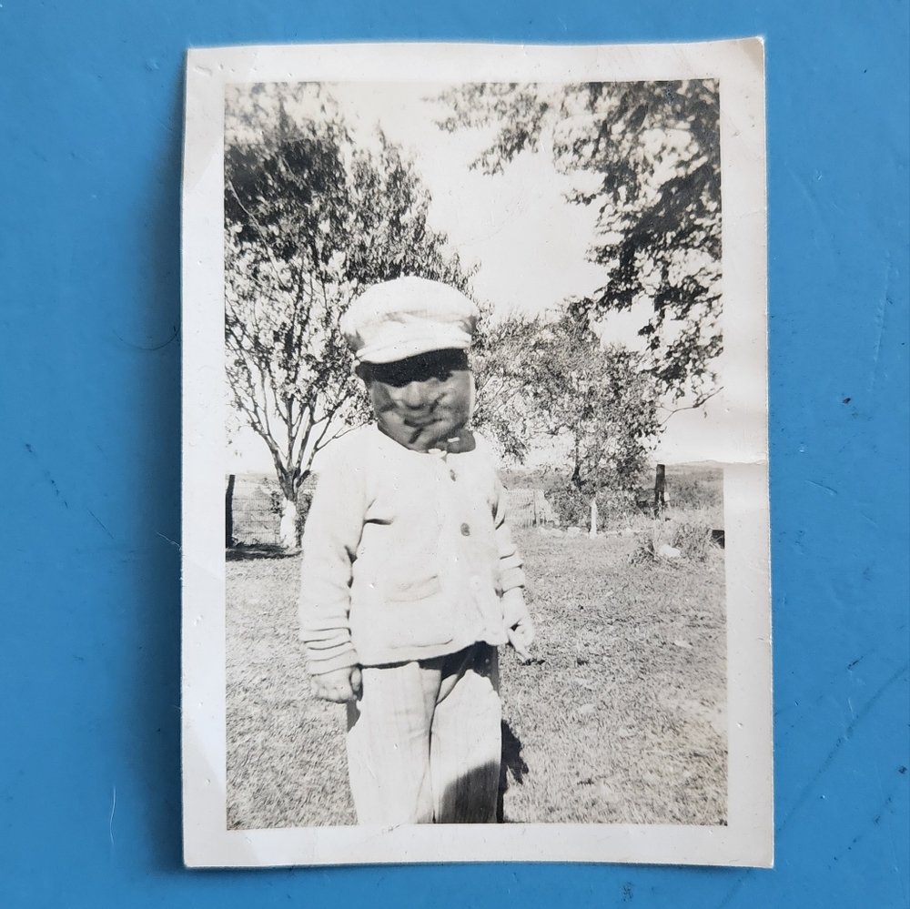 Vintage photo of creepy boy with mask